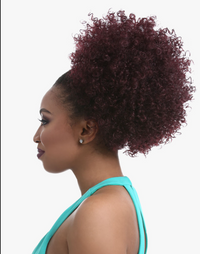 Thumbnail for A woman shown in side profile wearing a voluminous, high-pile curly hair extension or wig in a deep burgundy shade, paired with a turquoise top against a plain white background.