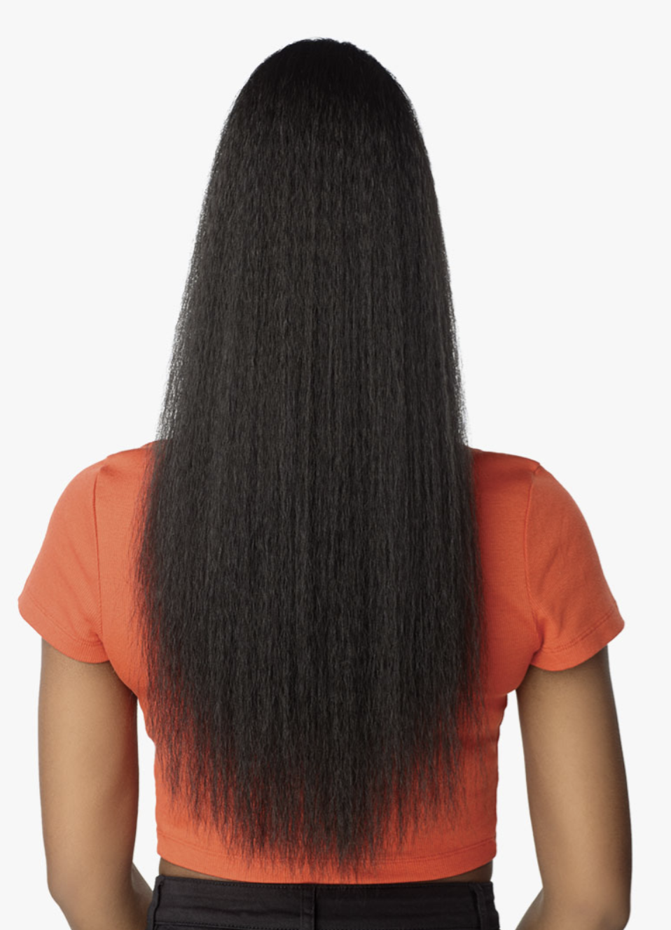 A person shown from the back wearing a bright orange crop top, displaying a very long, straight, black hair extension or wig. The background is a clean, solid white studio setting.