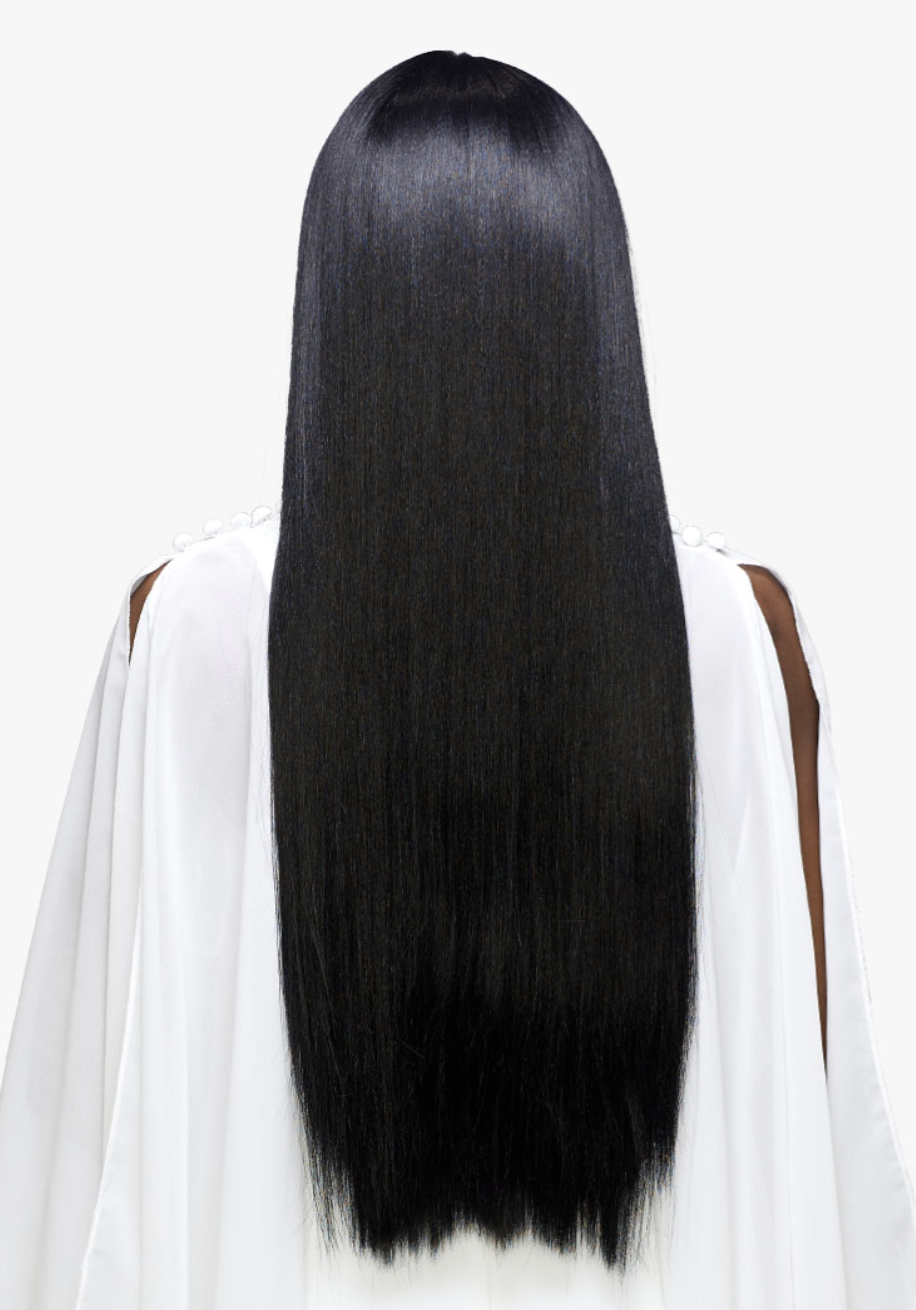 Person with long black hair wearing a white outfit on a white background
