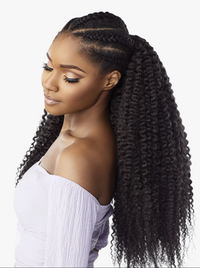 Thumbnail for A woman shown in side profile wearing a long, dark curly hair extension or wig with a half-up style and braided detail at the crown, against a plain light background.