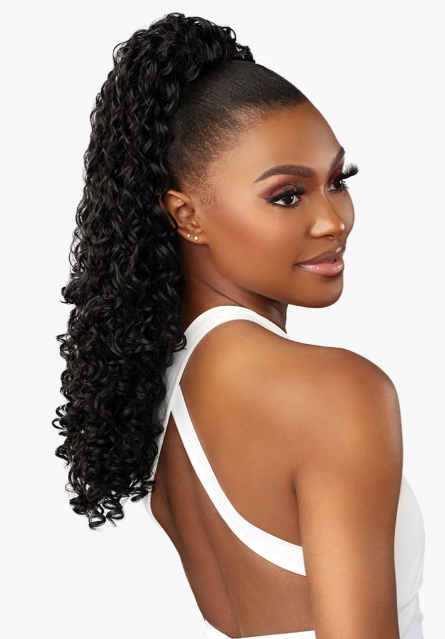A woman with a high-volume, curly black ponytail extension shown from a three-quarter back view against a plain white background.