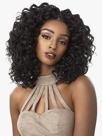 Thumbnail for Woman with voluminous curly black hair wearing a beige halter top on a white background