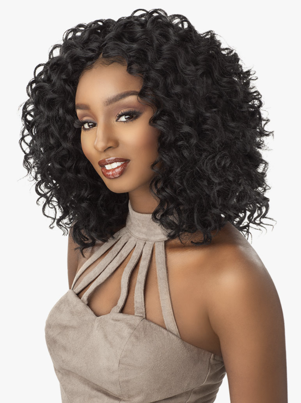Woman with styled black hair wearing a beige dress against a white background