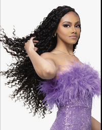 Thumbnail for A woman with long, voluminous, tightly curled black hair is shown against a plain white background, wearing a strapless lavender sequined dress with a fluffy feathered neckline.