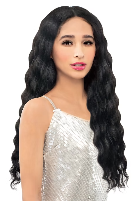 Woman with long black wavy hair wearing a silver sequin dress on a white background