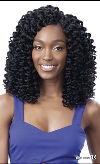 Thumbnail for Woman with voluminous curly hair wearing a blue top on a white background