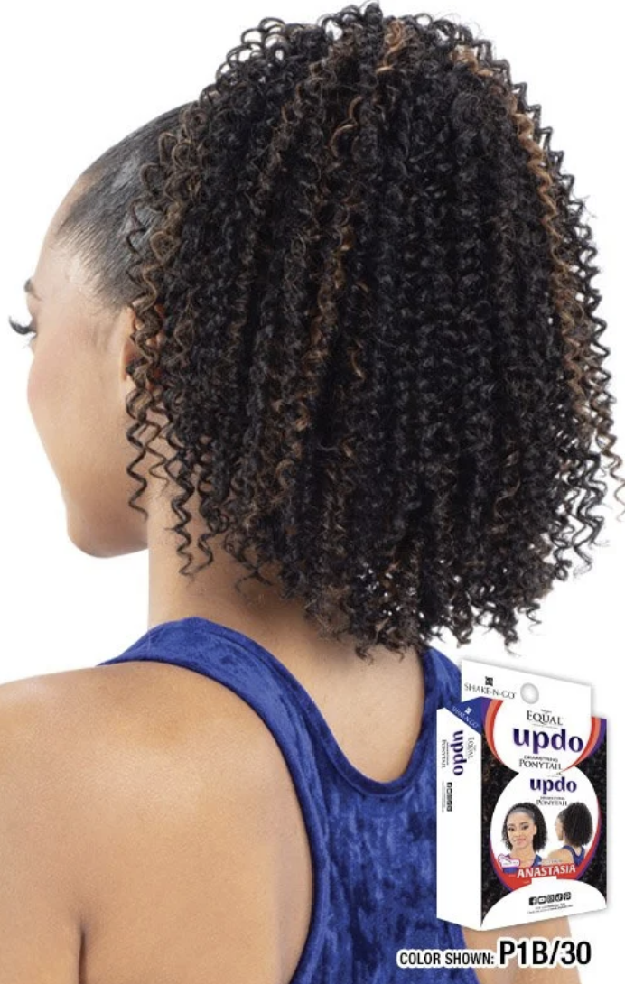 Woman with styled hair and a box of hair product in the background
