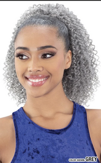 Thumbnail for Woman with styled hair in a blue top against a white background