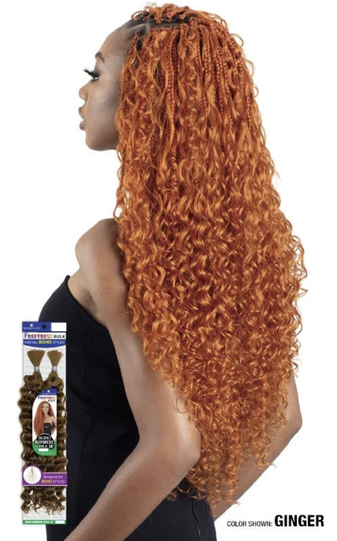 Woman with long, wavy ginger hair extensions and product packaging in the foreground.