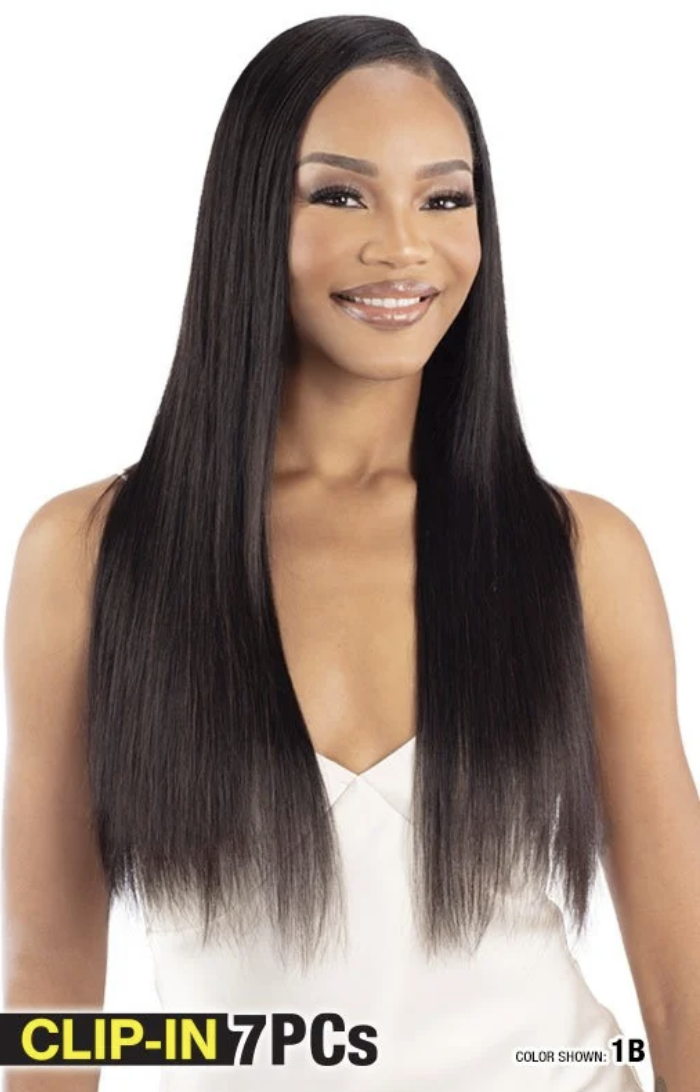 Woman with long straight black hair styled in a clip-in 7-piece wig, on a white background.