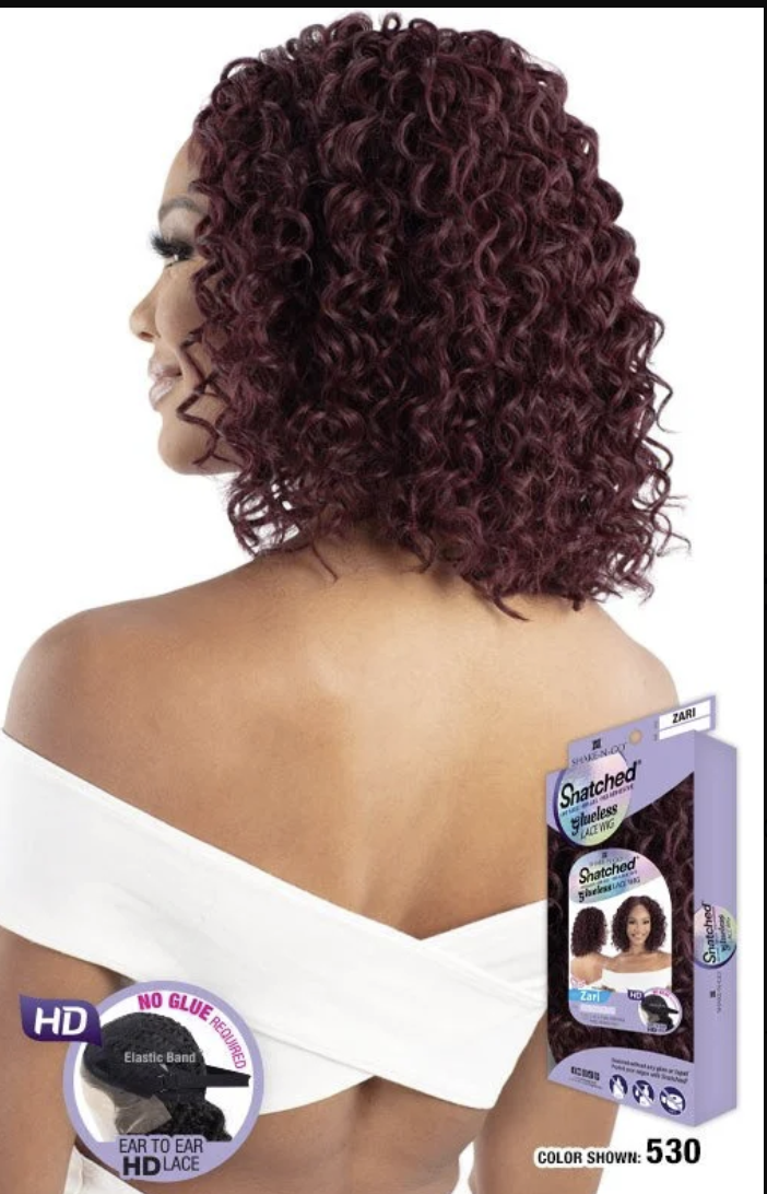 Woman with styled hair and a hair product packaging on a white background