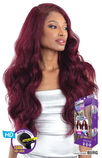 Woman with burgundy wig and product packaging on a white background