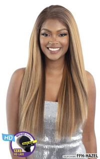 Thumbnail for Woman with long blonde hair styled in a straight manner, wearing a silver dress.